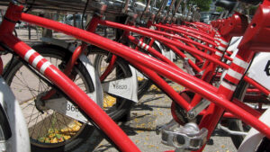 A line of red bikes, lined up and ready to go, symbolic of getting the change you want to be.