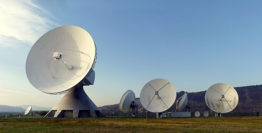 Large satellite dishes, broadcasting the Not A Blue Tree podcast about coaching.