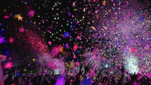 People celebrating with brightly lit confetti filling the picture