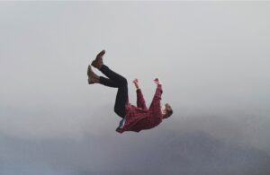 A person falling, seemingly from the sky