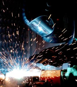 A person welding, with sparks flying