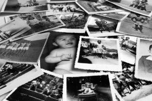 A sprawling pile of black and white photos, showing images from the past