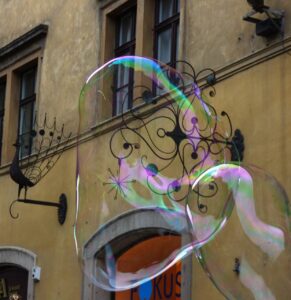 Two large bubbles floating away, released like negative emotions and limiting beliefs to float and then disappear.