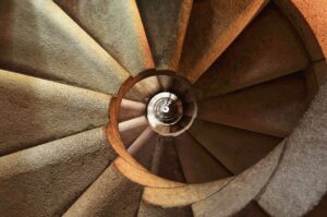 An optical illusion of a spiral staircase going downwards to infinity