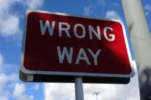 A red sign which says "Wrong Way"